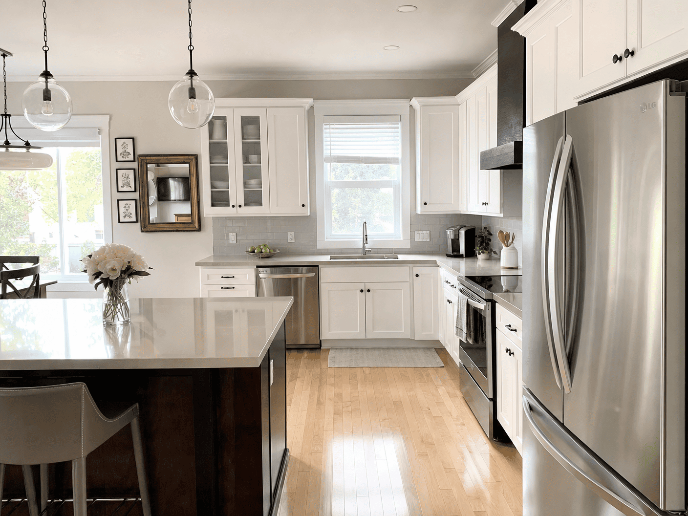Bright white kitchen with clean counters and floors