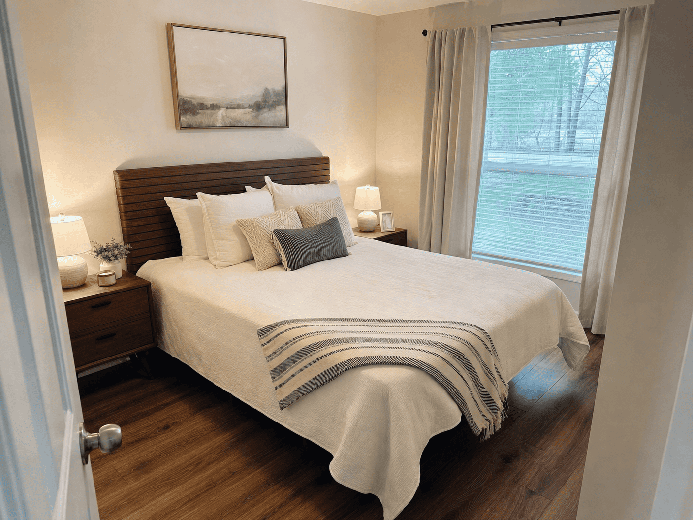 Neatly prepared bedroom with made bed